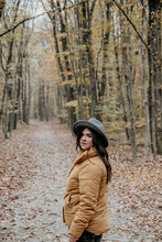 Beautiful Woman Posing In An Autumn  Forest