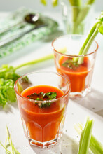 Glasses Of Tomato Juice With Celery And Parsley