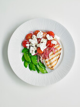 Chicken Breast With Feat Tomatoe Salad And Sugar Peas