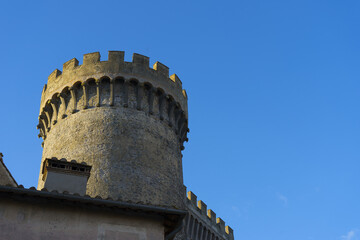 Medieval castle tower with blue sky background