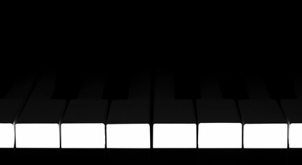 Piano keys in the shade. The side of the piano keyboard is illuminated.