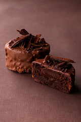 Poster - Stack of chocolate brownies chocolate cake on a brown background