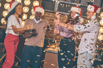 Poster - Smiling people in Santa hats while confetti is falling