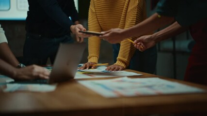 Aufkleber - Close Up of Diverse Multiethnic Team Having Conversation in Meeting Room in a Creative Office. Colleagues Lean On a Conference Table, Look at Laptop Computer and Make Notes with Pencils on Notebooks.