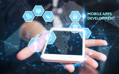 Business, Technology, Internet and network concept. Young businessman working on a virtual screen of the future and sees the inscription: Mobile apps development