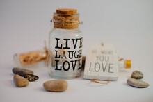 Closeup Shot Of A Jar With The Text Live Laugh Love In A Decoration Set