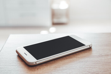 modern mobile phone on table, closeup