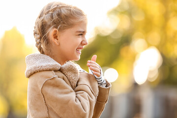 Sticker - Little girl suffering from allergy outdoors