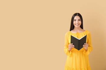 Sticker - Young woman reading book on color background