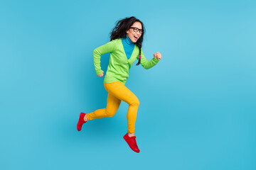 Poster - Full size profile side photo of brown messy pigtail haired woman jump run empty space isolated on blue color background