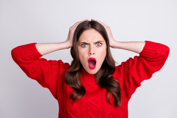 Sticker - Photo portrait of nervous worried girl amazed arguing with opened mouth holding hands on head isolated on pastel grey color background