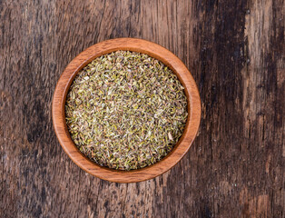 Wall Mural - Oregano in wood bowl on wooden