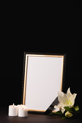 Wall Mural - Lily, candle and mirror with ribbon on black , funeral concept