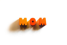 Wooden Orange Letters Text Word Mom With Shadows At Isolated White Background, Family, Kids Love, Motherhood Concept 
