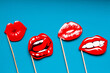 © Dubnytskaya Photo - red attractive female lips on a blue bright background