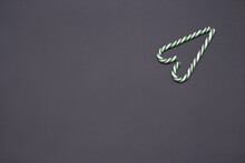 Green Candy Cane On Grey Background