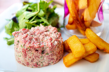 Wall Mural - Tasty Steak tartare (Raw beef) - classic steak tartare on white plate