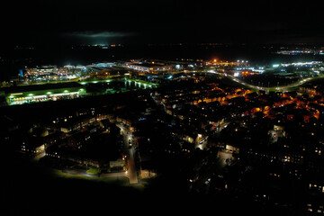 Wall Mural - Beautiful aerial view of Bridgwater cityscape with bright glowing night lights in Somerset, UK