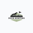 © mr.bagaskara - Vector illustration of dog hunt the flying duck good for duck hunting club logo, badge, and sticker design