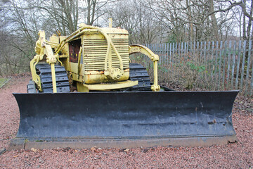 Wall Mural - Vintage bulldozer in a wood	