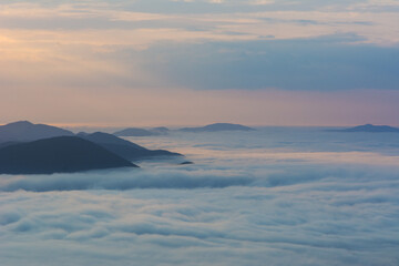 Wall Mural - beautiful sunrise in the carpathian mountains with fog and dramatic sky