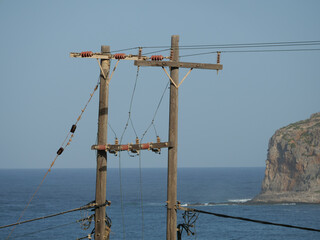 Sticker - View of electric post near the sea in Crete, Greece