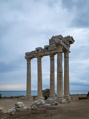 The ruins and columns of majestic Apollo temple in Side Antalya Turkey with a cloudy sky background