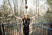 Young Woman Feeling Free And Happy Before A Bungee Jump From The Tower In The Rope Park