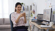 © PRPicturesProduction - elegant asian lady freelance working at home office, joyfully checking message with good news on smart phone in early morning.