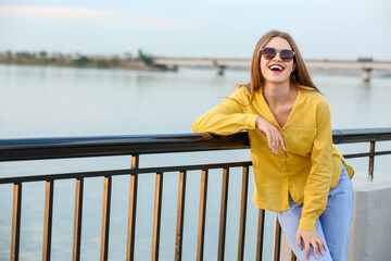 Wall Mural - Beautiful woman with stylish sunglasses outdoors