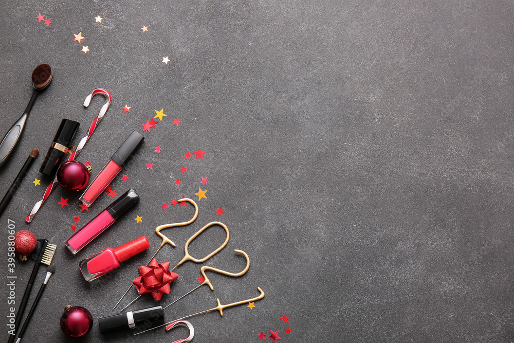 New Year composition with makeup cosmetics on dark background