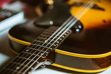 Sticker - Closeup shot of a wooden guitar on the table