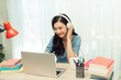 © makistock - Portrait of a young asian woman in a room. Working at home. Remote work. Teleworking. Freelancer.