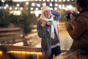 Wall Mural - Couple having fun on a winter night