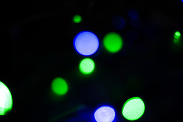 Wall Mural - Abstract bokeh background wallpaper. colorful lights on a black background