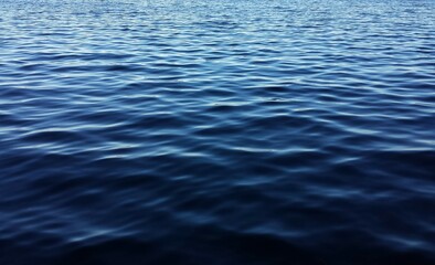 Dark blue water surface with soft waves on Florida river