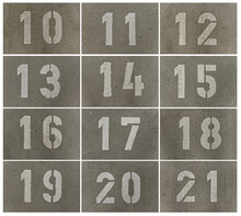 Parking Lot Numbers In An Underground Car Park Sprayed Onto The Concrete Floor With A Template.