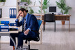 © Elnur - Young businessman employee rejecting new ideas with lots of pape