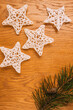 © photosvideos - traditional crochet Christmas tree decorations, wooden background, christmas, flat lay