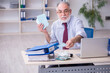 © Elnur - Old male accountant in budget planning concept in the office