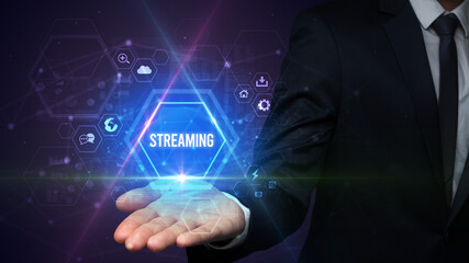 Man hand holding STREAMING inscription, social media concept