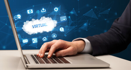 businessman working on laptop with virtual inscription, modern technology concept