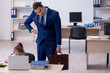 © Elnur - Young male employee and his little girl in the office