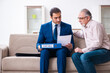 © Elnur - Young male lawyer visiting old man in testament concept