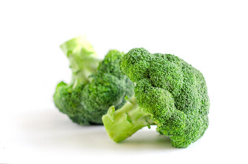 Fresh organic broccoli vegetable piece on white background