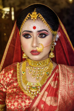 Portrait of very beautiful surprised Indian bride closeup. Concept of human emotions