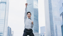Businessman Jump High And Raise Hand To Celebrate The Victory