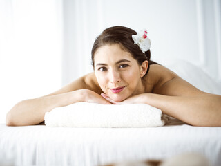 Portrait of smiling brunette woman looking at camera. Beauty concept