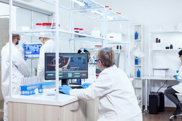Wall Mural - doctor in chemistry and her multiethnic teamn engineering drug. senior scientist in pharmaceuticals 
