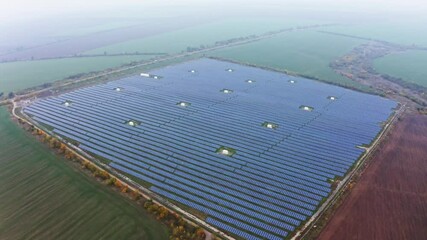 Wall Mural - Power plant using renewable solar energy. Aerial UHD 4K drone realtime video, shot in 10bit HLG and colorized